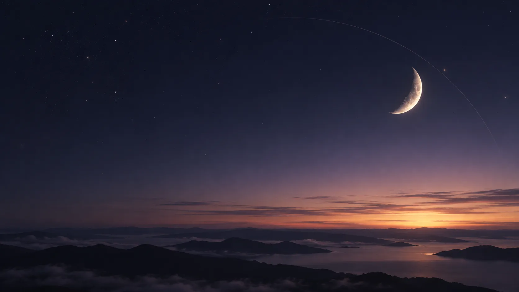 A thin crescent Moon above the horizon at dawn